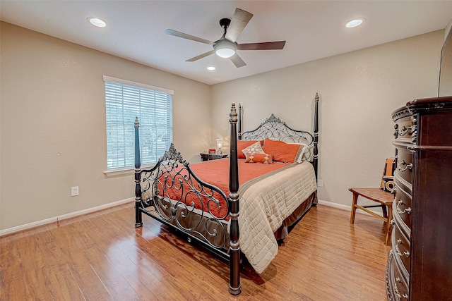 bedroom featuring ceiling fan and light hardwood / wood-style floors