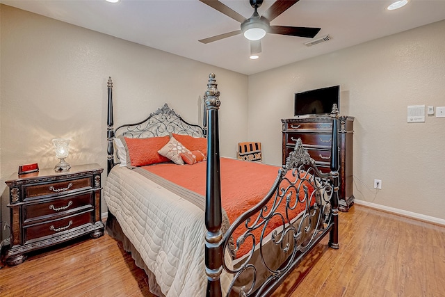 bedroom featuring ceiling fan and light hardwood / wood-style flooring