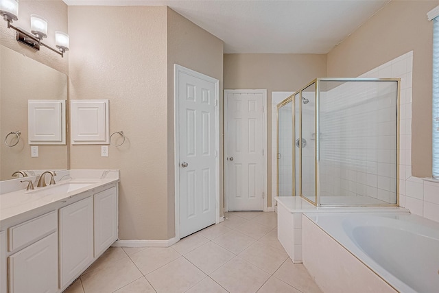 bathroom featuring vanity, tile patterned flooring, and plus walk in shower