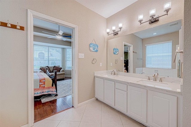 bathroom featuring ceiling fan, tile patterned floors, and vanity