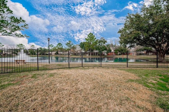 exterior space featuring a water view and a lawn