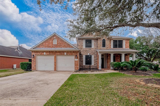 view of front of property with a front lawn and a garage