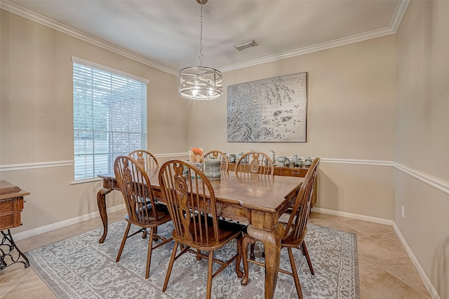 dining space featuring light tile patterned floors, crown molding, and a chandelier