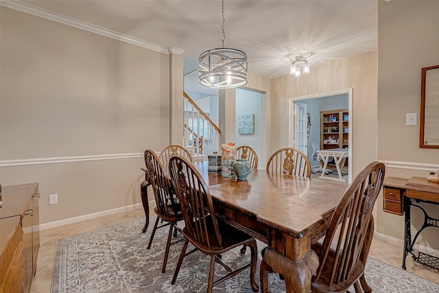 tiled dining room with ornamental molding and a chandelier