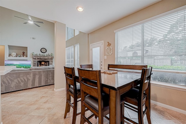 dining area featuring ceiling fan and light tile patterned floors