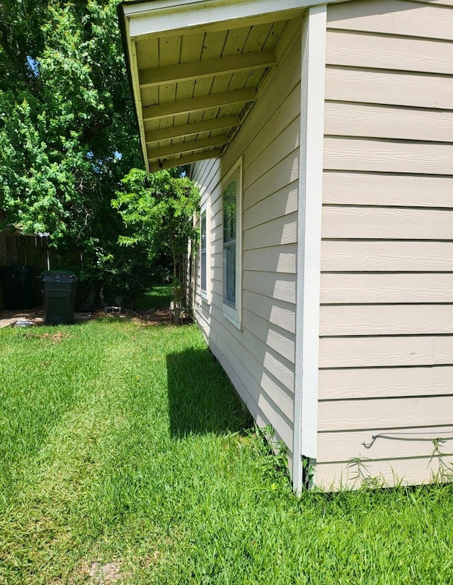 view of home's exterior featuring a yard