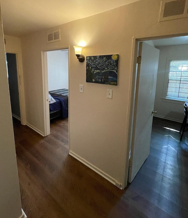 8130 Rockford Dr, Houston, TX 77033 - hall featuring baseboards and dark wood-style flooring