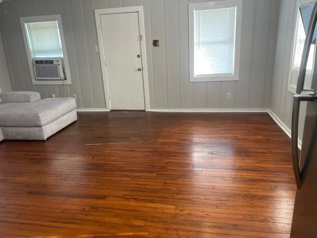 foyer featuring cooling unit and dark wood-type flooring