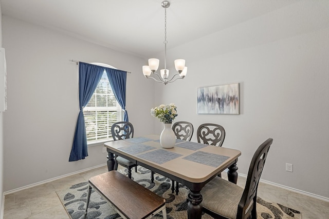 tiled dining area with a notable chandelier