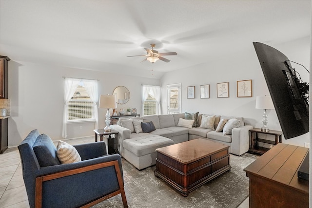 living room with light tile patterned floors and ceiling fan