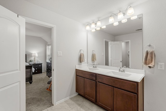 bathroom with tile patterned flooring and vanity