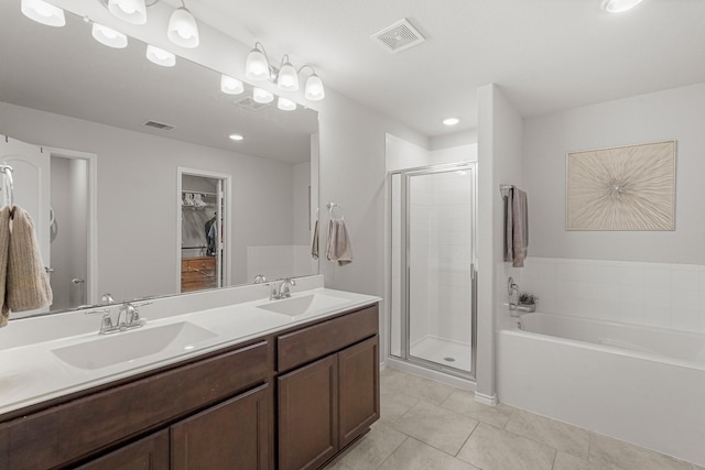 bathroom featuring vanity, tile patterned floors, and independent shower and bath