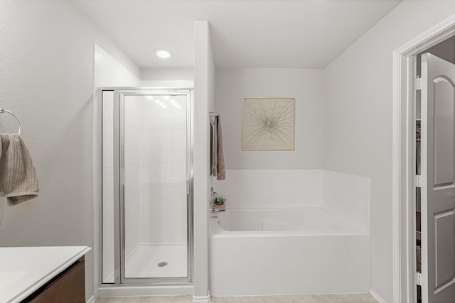 bathroom featuring vanity and separate shower and tub