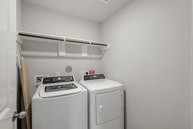 laundry room with washing machine and dryer