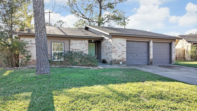 single story home featuring a garage and a front lawn