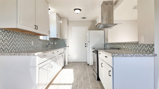 kitchen with white cabinetry, sink, light stone countertops, ventilation hood, and stainless steel electric range