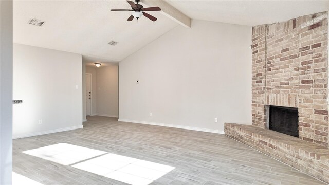 unfurnished living room featuring ceiling fan, light hardwood / wood-style floors, and a brick fireplace