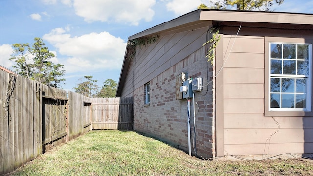 view of property exterior with a lawn