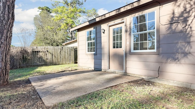 view of side of property with a patio area