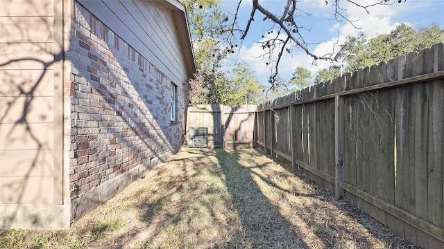 view of yard with central AC