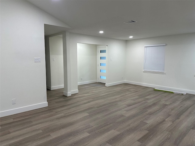 empty room featuring dark wood-type flooring