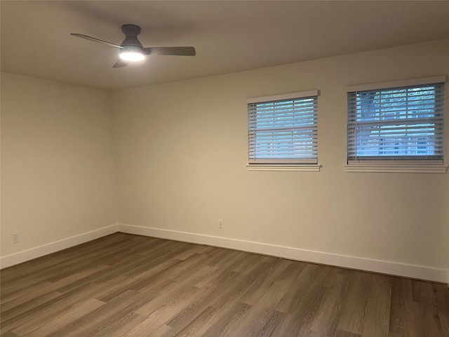 empty room with hardwood / wood-style flooring and ceiling fan