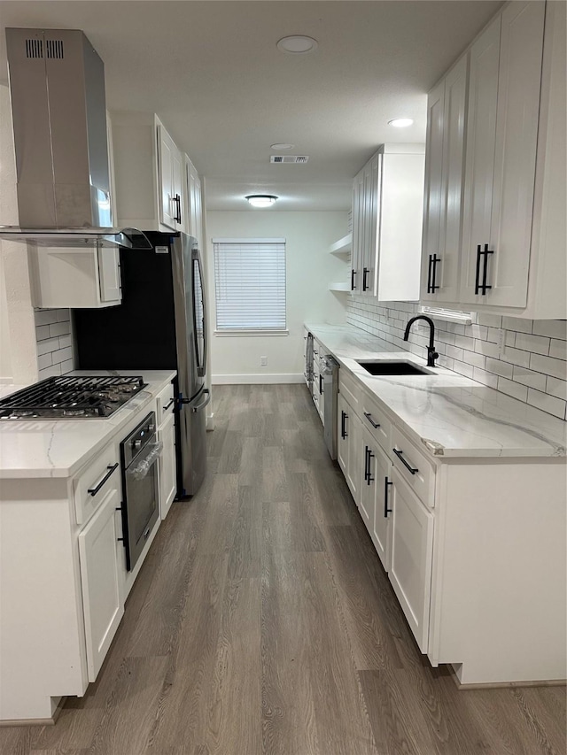 kitchen with white cabinetry and stainless steel appliances