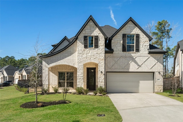 view of front of property with a garage and a front lawn