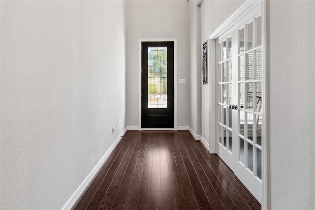 doorway featuring dark wood-type flooring