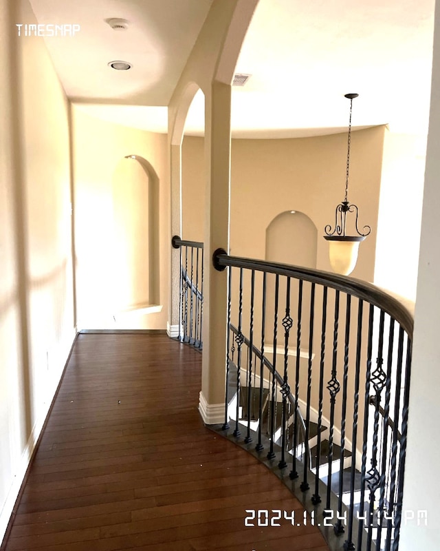 hallway with dark wood-type flooring