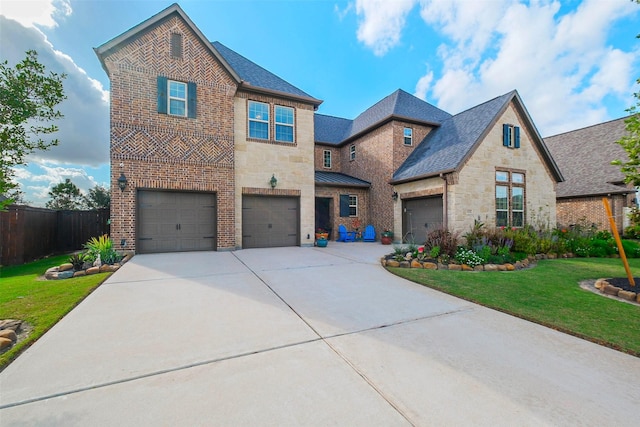 view of front of house with a front lawn and a garage