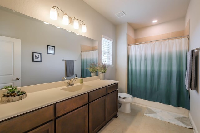 full bathroom featuring tile patterned flooring, vanity, shower / bath combination with curtain, and toilet