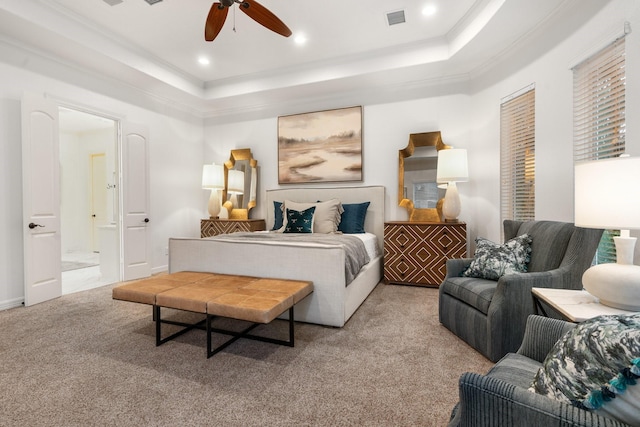 bedroom featuring a tray ceiling, ceiling fan, and light colored carpet