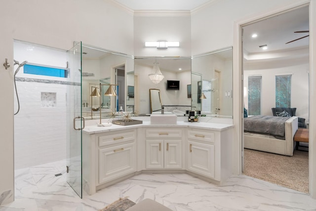 bathroom with vanity, ceiling fan, an enclosed shower, and crown molding