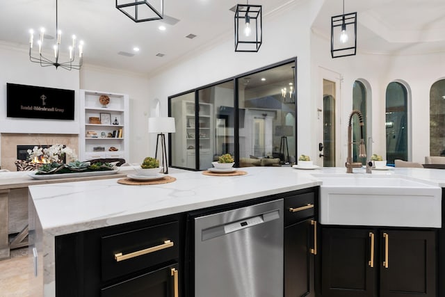 interior space featuring dishwasher, sink, light stone counters, and hanging light fixtures