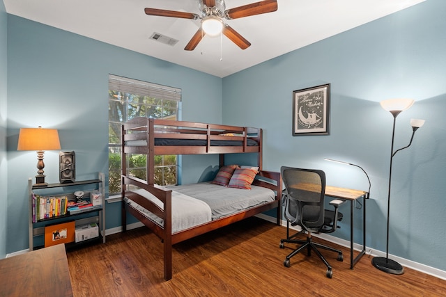 bedroom with dark wood-type flooring and ceiling fan