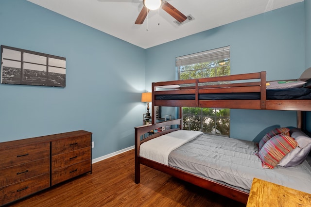 bedroom with ceiling fan and hardwood / wood-style floors