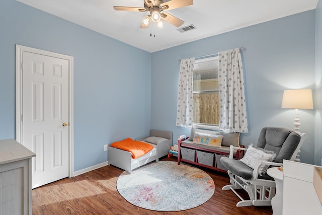 living area with light wood-type flooring and ceiling fan