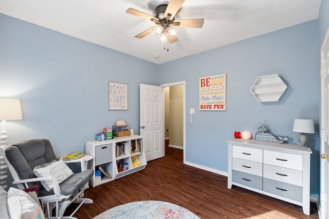 interior space featuring ceiling fan and dark hardwood / wood-style floors