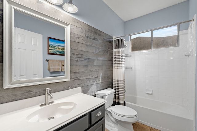 full bathroom with tile patterned flooring, shower / tub combo with curtain, toilet, vanity, and wood walls