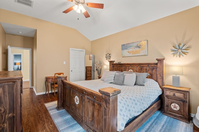 bedroom featuring ceiling fan, dark hardwood / wood-style floors, and vaulted ceiling