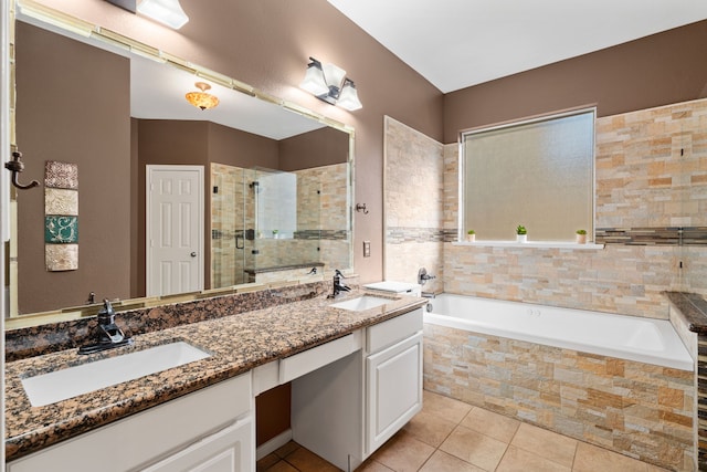 bathroom featuring independent shower and bath, tile patterned floors, and vanity