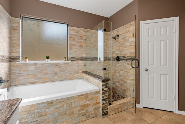 bathroom with shower with separate bathtub and tile patterned floors