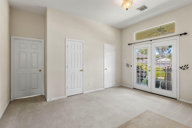 unfurnished bedroom with visible vents, baseboards, carpet, access to outside, and french doors