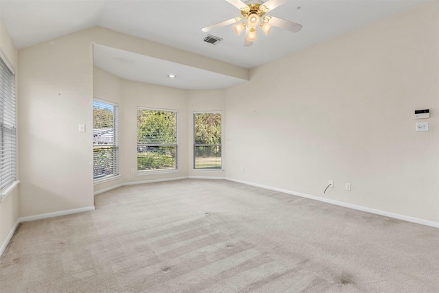 empty room with baseboards, visible vents, ceiling fan, and carpet flooring