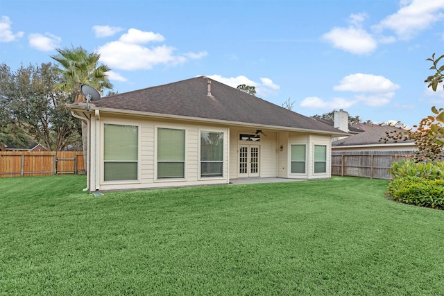 back of house with a yard, a fenced backyard, ceiling fan, and a patio