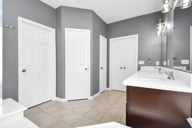 bathroom featuring tile patterned flooring and vanity