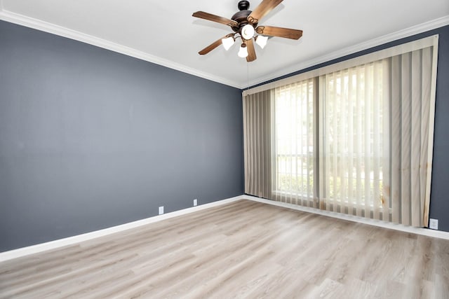 spare room featuring light hardwood / wood-style floors, ceiling fan, and ornamental molding