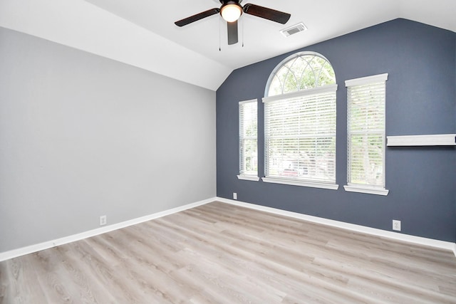 spare room featuring ceiling fan, light hardwood / wood-style floors, and lofted ceiling