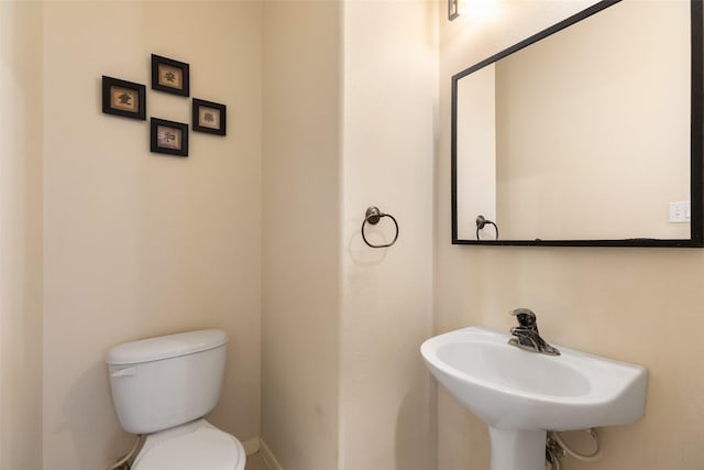 bathroom with sink and toilet